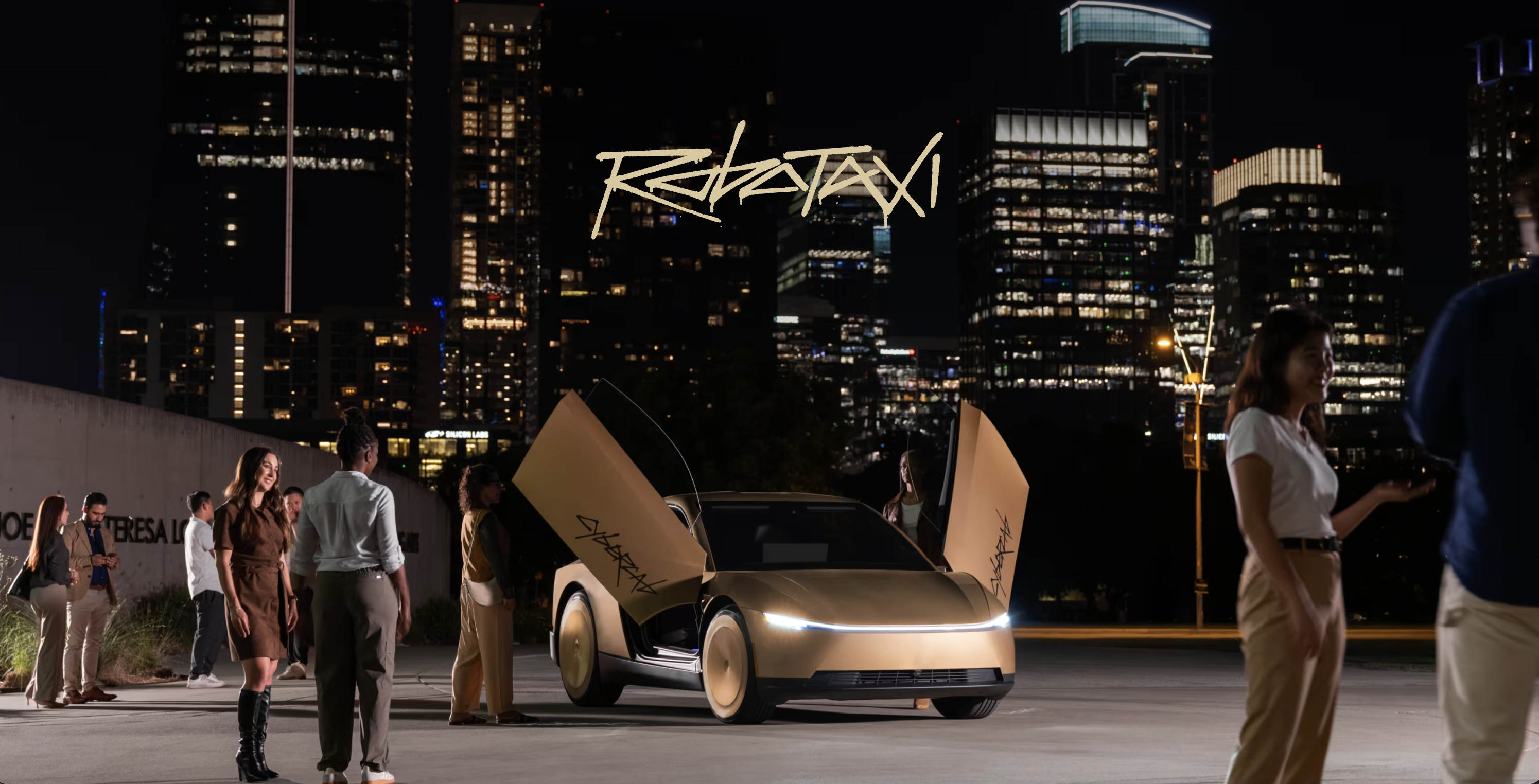 A gold car with both doors open beneath the word ROBOTAXI, ringed by people on a rooftop at night before a lit city skyline.